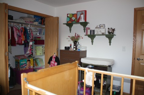 The wall with the dresser and shelfs.