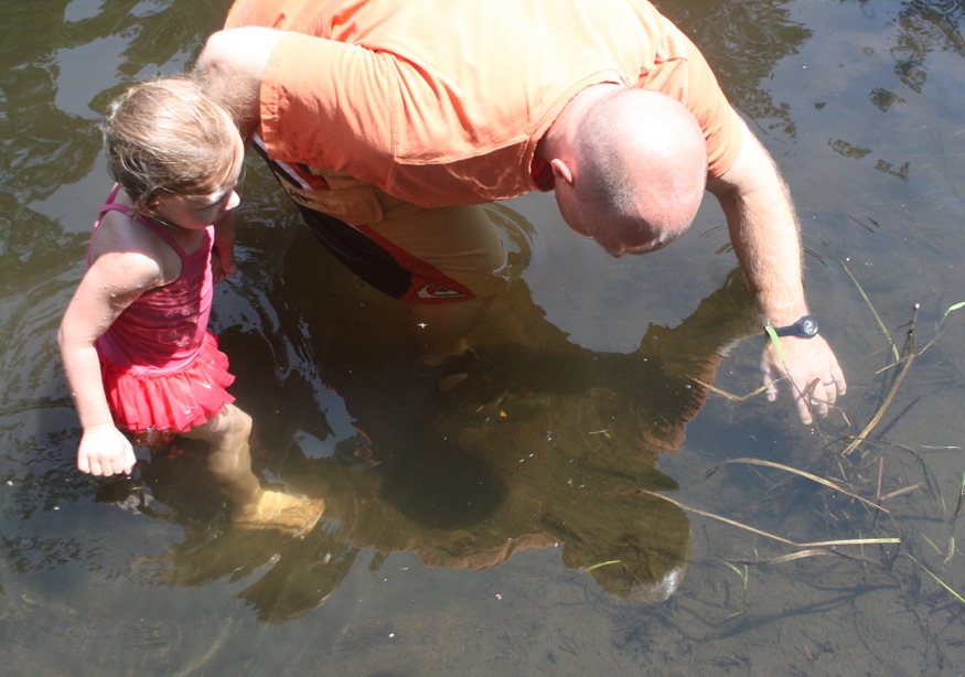 Trying to catch a crayfish.