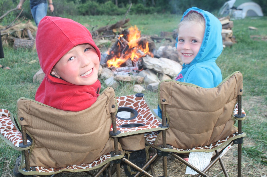 Two friends enjoying the campfire.