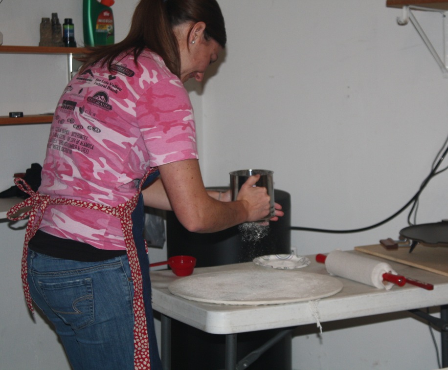 Trisha throwing flour in her own home.